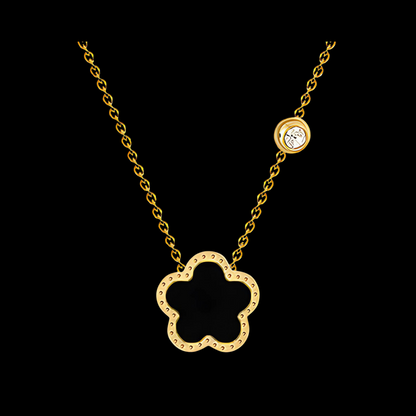 Gold necklace with a clover-shaped pendant on a black background Waterproof Jewllery Piece